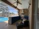 Inviting outdoor kitchen with bar seating, stainless steel grill, and a view of the sparkling pool at 10101 Paddock Oaks Dr, Riverview, FL 33569