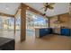Beautiful outdoor kitchen, pool, and screened-in patio with string lights at 10101 Paddock Oaks Dr, Riverview, FL 33569