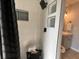 Modern shower with sleek black fixtures, white subway tile, built-in niches, and a convenient bench seat at 10101 Paddock Oaks Dr, Riverview, FL 33569