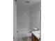Clean bathroom with white tile, a bathtub, and wooden vanity at 10737 Keys Gate Dr, Riverview, FL 33579
