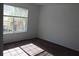 Empty bedroom with a large window, brown carpet, and white walls at 10737 Keys Gate Dr, Riverview, FL 33579
