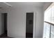 Bedroom with a partially open closet and windows with blinds at 10737 Keys Gate Dr, Riverview, FL 33579