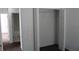 Open closet with a hanger bar and a door to the bathroom at 10737 Keys Gate Dr, Riverview, FL 33579