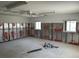 Large garage space featuring two windows, concrete floors, and insulated wall panels at 15816 2Nd St E, Redington Beach, FL 33708