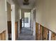 Hallway shows studs ready for renovation at 15816 2Nd St E, Redington Beach, FL 33708