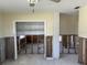 View of the living room shows studs ready for renovation at 15816 2Nd St E, Redington Beach, FL 33708