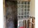 Glass block accents the shower with slate tile, studs and mesh backing ready for renovation at 15816 2Nd St E, Redington Beach, FL 33708
