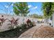 Private backyard oasis with patio, garden, and walkway at 1816 Woodridge Dr, Clearwater, FL 33756