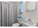 Small bathroom with shower, toilet, and sink at 1816 Woodridge Dr, Clearwater, FL 33756