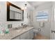 Bathroom with granite countertop and single sink at 1816 Woodridge Dr, Clearwater, FL 33756