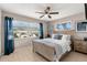 Bright bedroom with a wooden bed frame and blue accents at 1816 Woodridge Dr, Clearwater, FL 33756