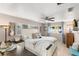 Bright bedroom with a king-size bed and ensuite bathroom at 1816 Woodridge Dr, Clearwater, FL 33756