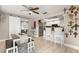 Kitchen dining area with a rustic table and cross decor at 1816 Woodridge Dr, Clearwater, FL 33756