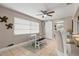 Small dining area with a white table and bench seating at 1816 Woodridge Dr, Clearwater, FL 33756