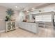 White kitchen with granite countertops and breakfast bar at 1816 Woodridge Dr, Clearwater, FL 33756