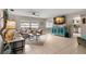 Spacious living room with tiled floors and comfy seating at 1816 Woodridge Dr, Clearwater, FL 33756