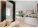 Bright living room, featuring tiled floors and a large TV at 1816 Woodridge Dr, Clearwater, FL 33756