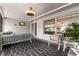 Comfy screened porch with seating and a TV at 1816 Woodridge Dr, Clearwater, FL 33756