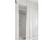 Clean shower with white tiles and a curtain at 1816 Woodridge Dr, Clearwater, FL 33756