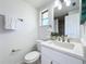 Updated bathroom with white vanity and a walk-in shower at 2460 Terry Ln, Sarasota, FL 34231