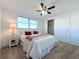 Comfortable bedroom with ceiling fan and a large closet at 2460 Terry Ln, Sarasota, FL 34231