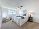 Spacious bedroom with a ceiling fan and ample natural light at 2460 Terry Ln, Sarasota, FL 34231
