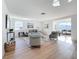 Open concept living area with hardwood floors and sunlit windows at 2460 Terry Ln, Sarasota, FL 34231