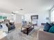 Bright and airy living room featuring hardwood floors and comfy seating at 2460 Terry Ln, Sarasota, FL 34231