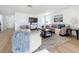 Spacious living room with hardwood floors and a cozy seating area at 2460 Terry Ln, Sarasota, FL 34231
