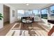 Bright sunroom with large windows and access to backyard at 2460 Terry Ln, Sarasota, FL 34231