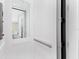 Home elevator with a mirrored back and brushed metal hand rail at 3025 Oakmont Dr, Clearwater, FL 33761