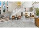Elegant foyer showcases a staircase with glass railings and marble flooring leading into the living space at 3025 Oakmont Dr, Clearwater, FL 33761