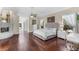 Spacious main bedroom features wood floors, ensuite bathroom, fireplace, and natural lighting at 3025 Oakmont Dr, Clearwater, FL 33761