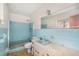 Bathroom with light blue tile and vintage fixtures at 3700 Dana Shores Dr, Tampa, FL 33634