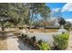 Landscaped yard with walkway and white wall at 3700 Dana Shores Dr, Tampa, FL 33634