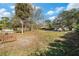 House with large front yard, mature trees, and landscaping at 3700 Dana Shores Dr, Tampa, FL 33634