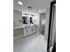 Updated bathroom with double vanity and modern finishes at 440 S Gulfview Blvd # 1201, Clearwater Beach, FL 33767