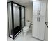 Updated bathroom featuring a walk-in shower and upgraded cabinetry at 440 S Gulfview Blvd # 1201, Clearwater Beach, FL 33767