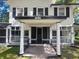 Charming two-story home with a covered front porch and black and white trim at 5121 40Th N Ave, St Petersburg, FL 33709