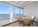 Balcony with a dining set overlooking the ocean, providing scenic views and fresh air at 7000 Beach Plz # 706, St Pete Beach, FL 33706