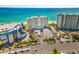 Aerial view of the building and parking lot from the street at 7000 Beach Plz # 706, St Pete Beach, FL 33706
