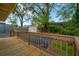 Wooden deck, shed, basketball hoop, and fenced backyard at 703 W Sligh Ave, Tampa, FL 33604