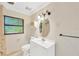 Clean and bright bathroom with white vanity and neutral tile at 703 W Sligh Ave, Tampa, FL 33604