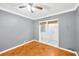 Cozy bedroom with hardwood floors and access to a private patio at 703 W Sligh Ave, Tampa, FL 33604