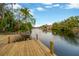Scenic view from the dock overlooking the tranquil canal and lush greenery at 703 W Sligh Ave, Tampa, FL 33604