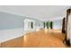 Spacious living room with wood-look flooring and arched doorways at 703 W Sligh Ave, Tampa, FL 33604