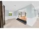 Spacious living room with tile floors and large windows overlooking backyard at 703 W Sligh Ave, Tampa, FL 33604