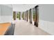 Sunroom or bonus room with tile flooring and large windows at 703 W Sligh Ave, Tampa, FL 33604