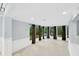 Large open living room with tile flooring and ample natural light at 703 W Sligh Ave, Tampa, FL 33604