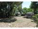 Spacious backyard with trees and storage shed at 7116 Kingsbury Cir, Tampa, FL 33610